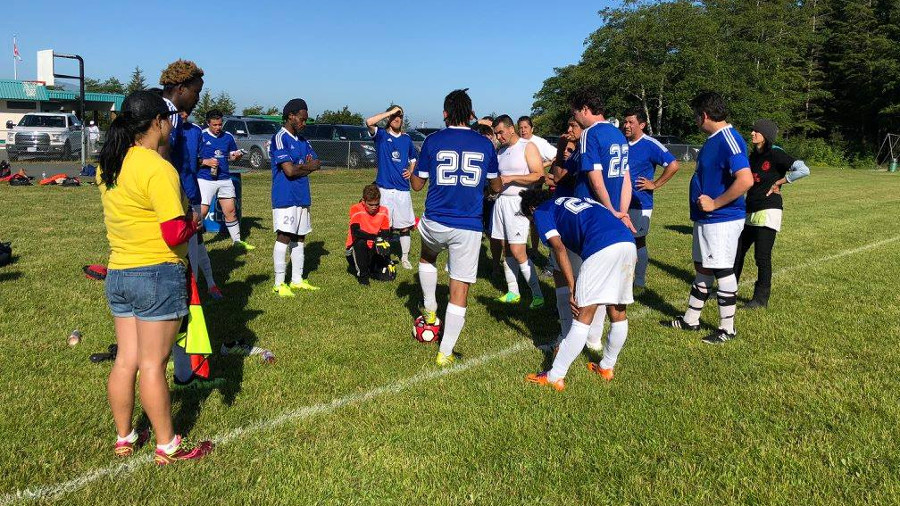 soccer team in a huddle